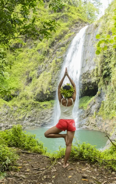Nature yoga session in front of a waterfall in the Papeno'o valley, Tahiti
