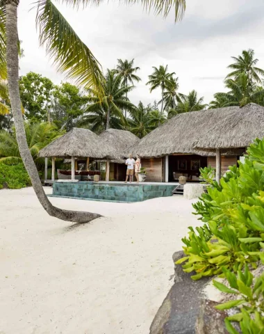 Couple at the Bora Bora by Pearl Resort with white sand beach © Grégoire Le Bacon